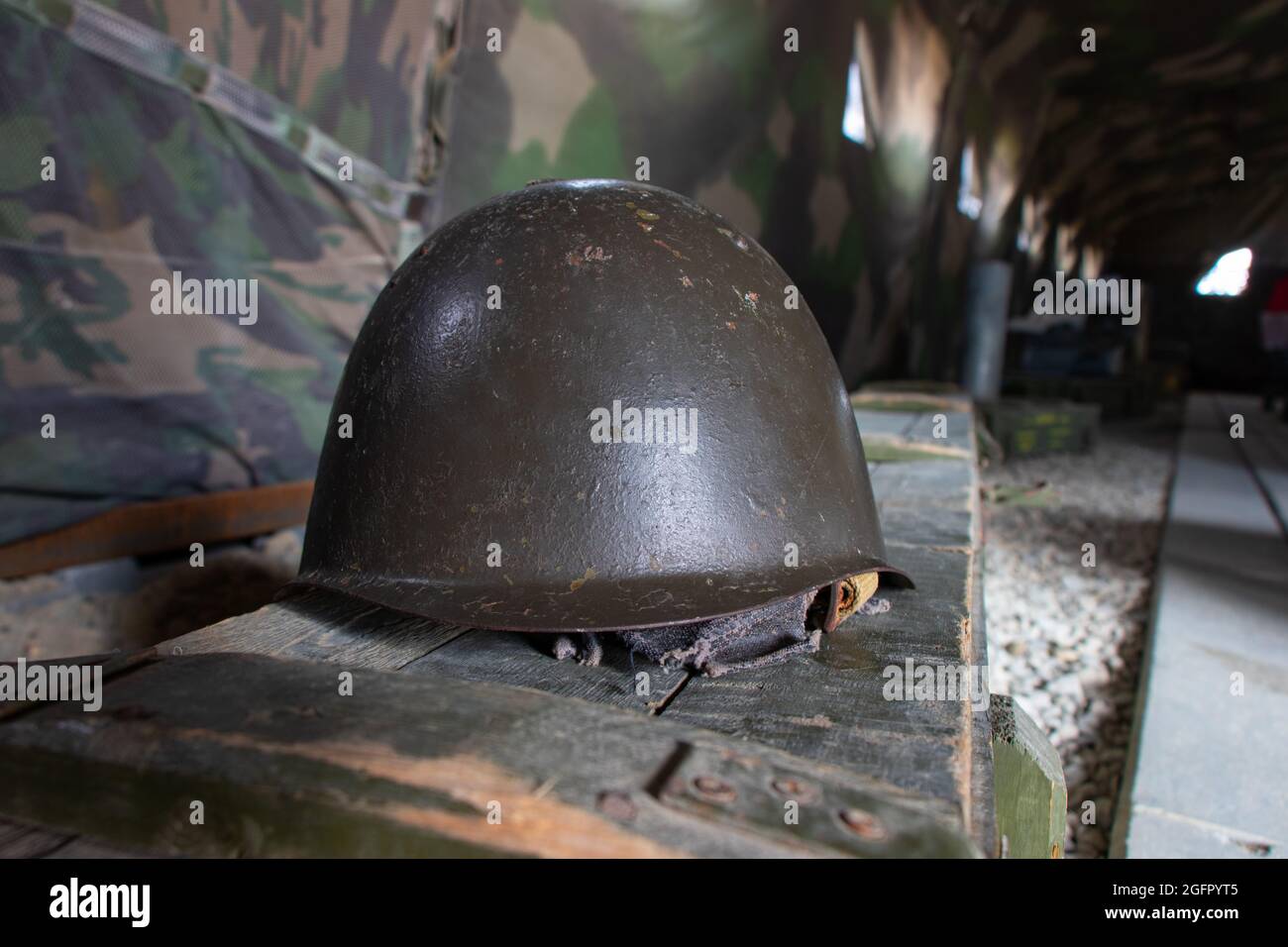 Old Military Helmet On The Ammunition Crate. Military Background. War Theme  With Helmet And Military Texture Stock Photo - Alamy