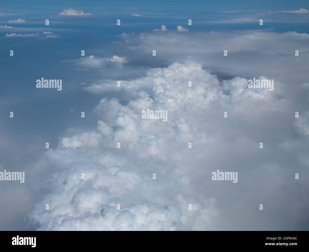 White clouds against a blue sky viewed from above Stock Photo - Alamy