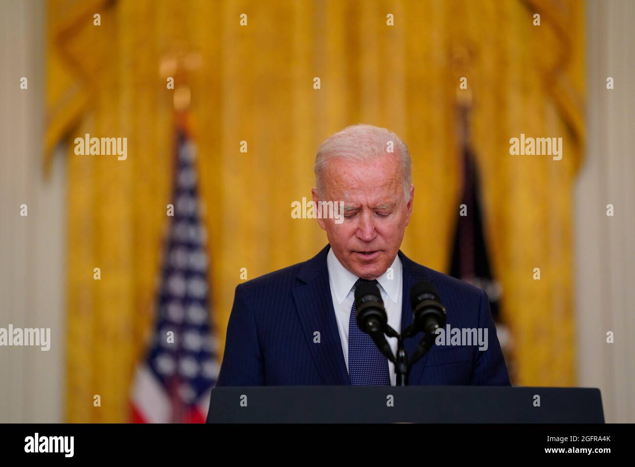 United States President Joe Biden delivers remarks on the terror attack at Hamid Karzai International Airport in Kabul Afghanistan, and the US service members and Afghan victims killed and wounded in the East Room of the White House in Washington, DC on Thursday, August 26, 2021. Credit: Stefani Reynolds/Pool via CNP Stock Photo