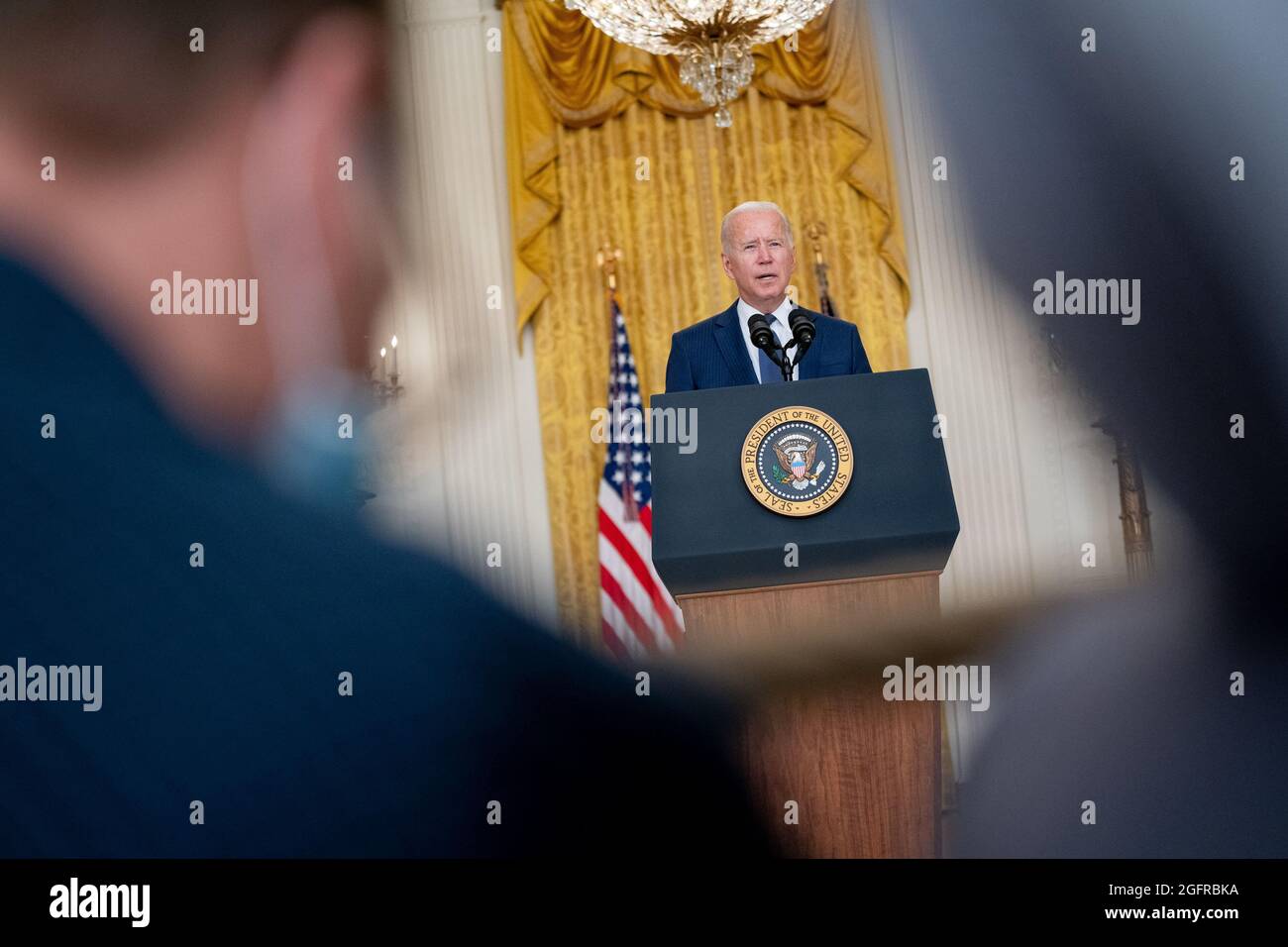 Washington, United States Of America. 26th Aug, 2021. United States President Joe Biden delivers remarks in the East Room of the White House in Washington, DC on Thursday, August 26, 2021. Multiple explosions near Hamid Karzai International Airport in Kabul, Afghanistan wounded many and killed at least 12 American service members. Credit: Stefani Reynolds/Pool/Sipa USA Credit: Sipa USA/Alamy Live News Stock Photo