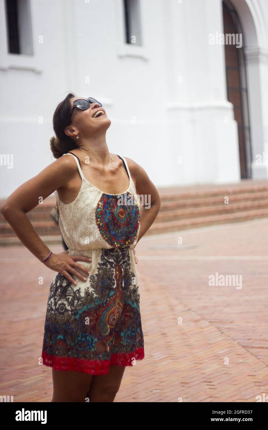 Vertical shot of a smiling Hispanic woman in Columbia Stock Photo