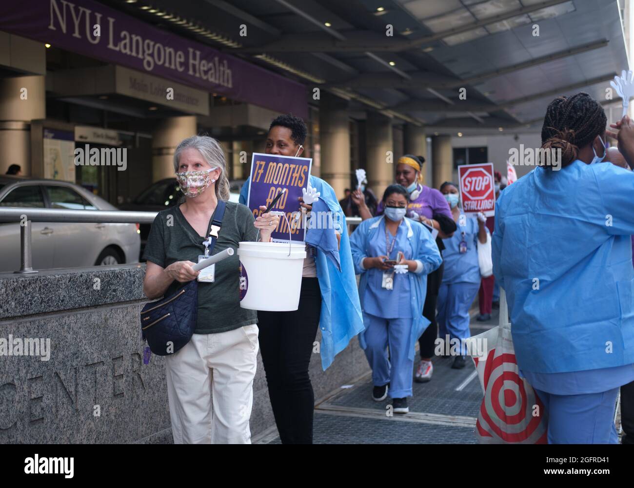 Brooklyn, New York, USA. 26th Aug, 2021. NYU Langone employees represented by the 1199 SEIU United Healthcare Workers union, in front of NYU hospital's main entrance at 560 1st