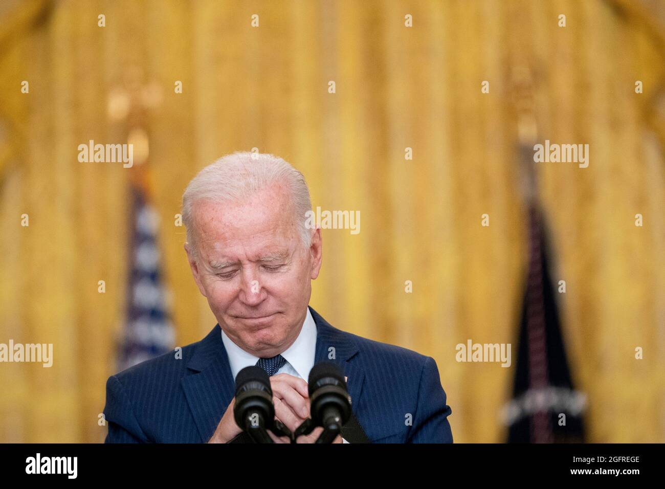 United States President Joe Biden delivers remarks in the East Room of the White House in Washington, DC on Thursday, August 26, 2021. Multiple explosions near Hamid Karzai International Airport in Kabul, Afghanistan wounded many and killed at least 12 American service members. Credit: Stefani Reynolds/Pool via CNP Stock Photo