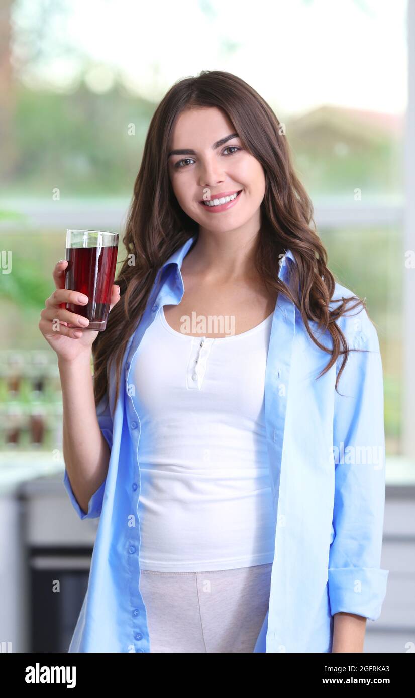 Young attractive woman drinking cherry juice Stock Photo Alamy