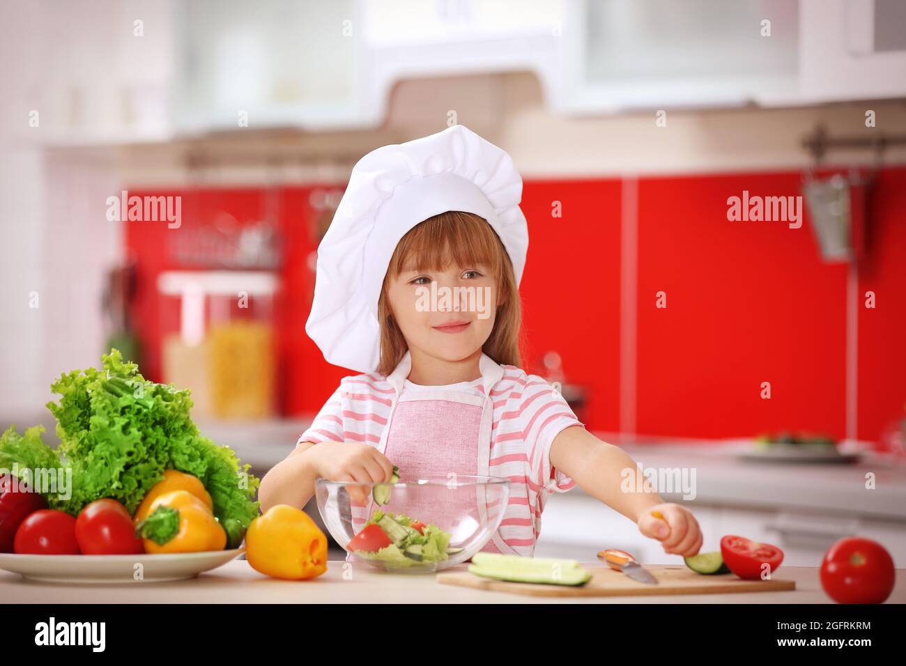 Little girl cooking in the kitchen Stock Photo Alamy