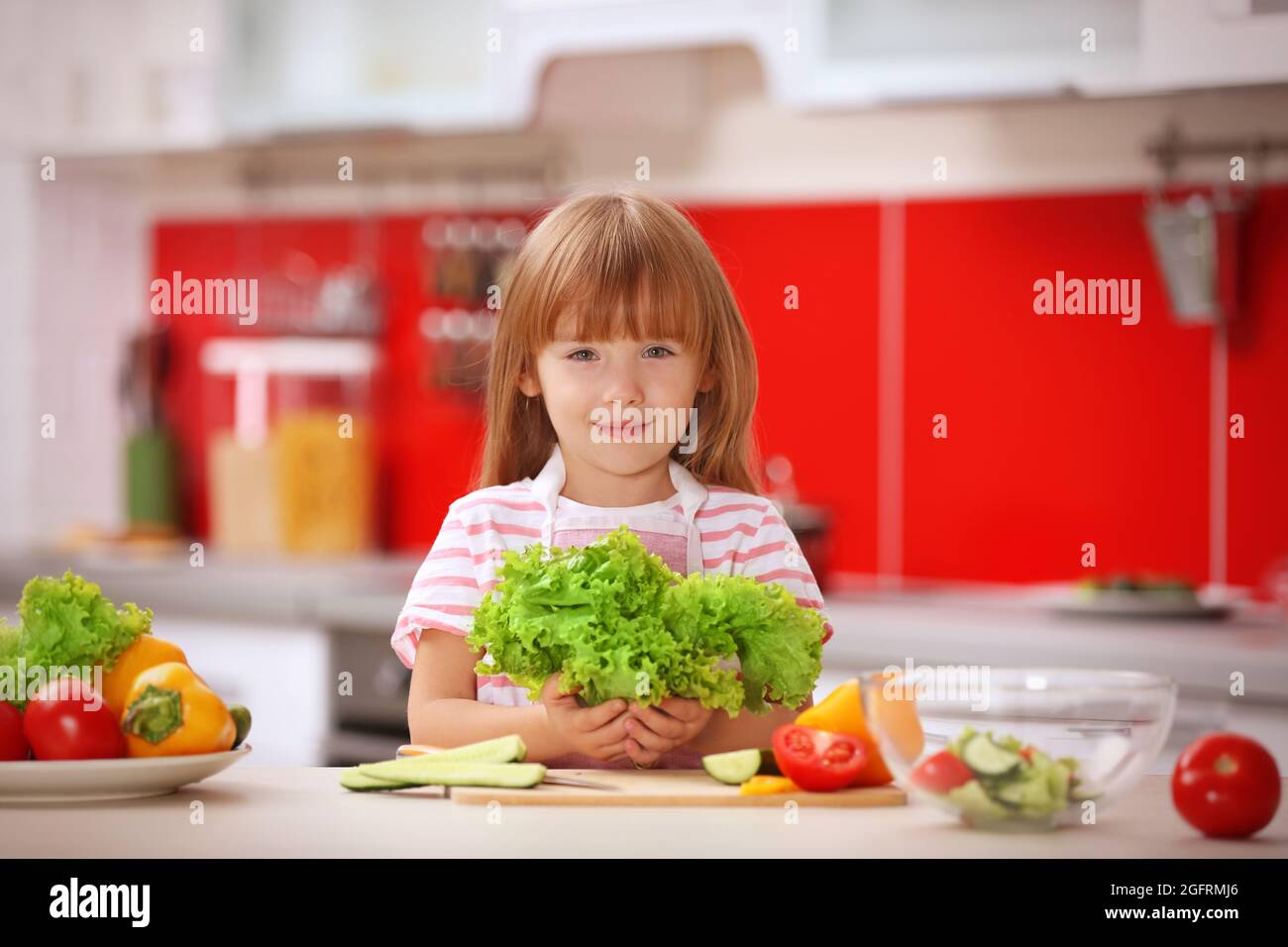 Little girl cooking in the kitchen Stock Photo Alamy