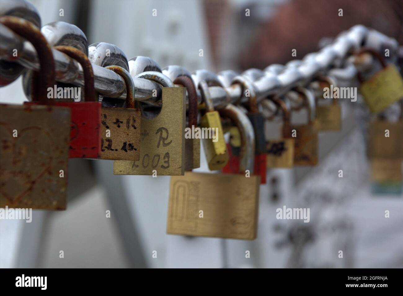 BREMEN, GERMANY - Aug 21, 2021: Locks on a chain with names and dates to remember Stock Photo