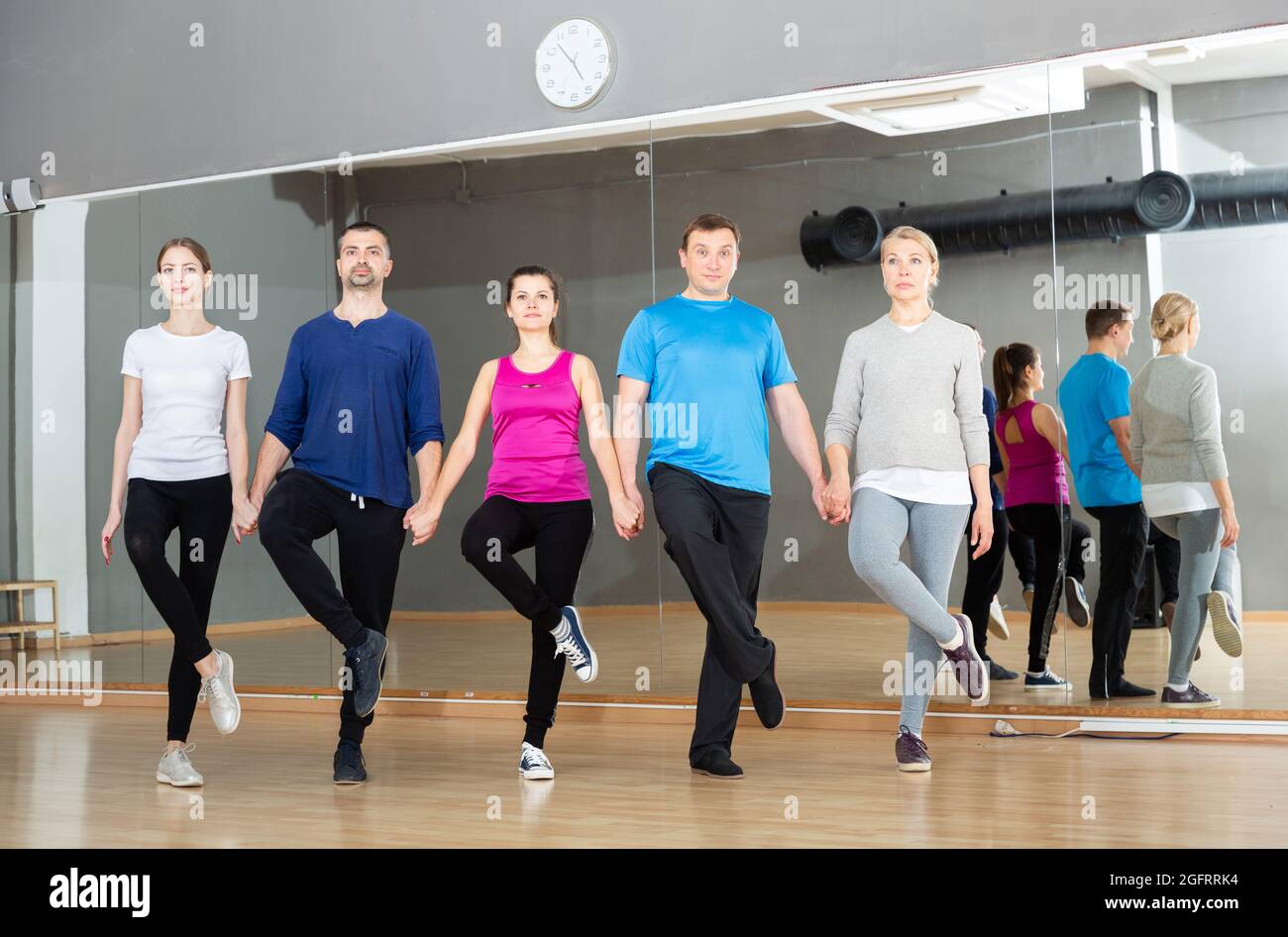 People fulfilling Celtic dance movements Stock Photo