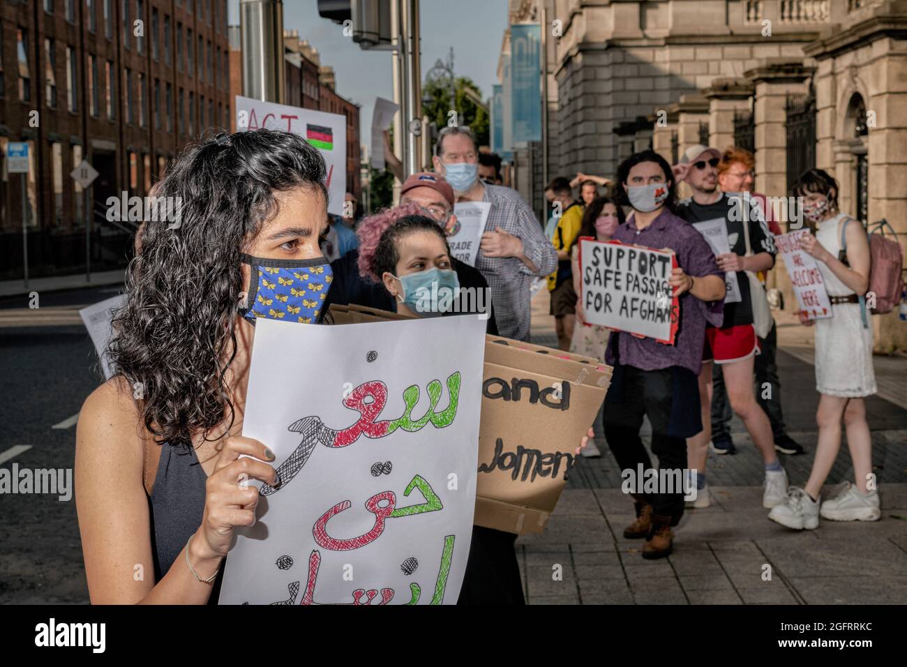 Protesters hold placards during the demonstration.A group of protestors gathered in front of Leinster House, the Irish parliament, in Dublin in solidarity with the Afghan people and to call for the Irish government to increase the number of refugees the country will pledge to grant visas to which is currently proposed at just under 200. The demonstration was organized by United against Racism group and was joined by other activists and groups such as ROSA and Le Chéile and was addressed by speaker Paul Murphy, TD for People Before Profit among others. (Photo by Graham Martin/SOPA Images/Sipa Stock Photo