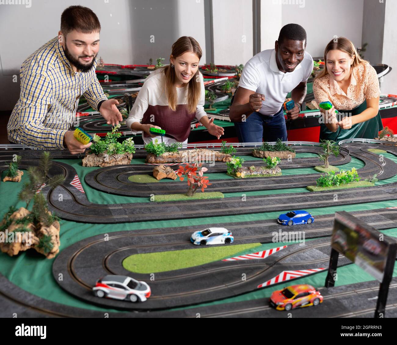 Racing car on the toy race track and emotional players Stock Photo Alamy