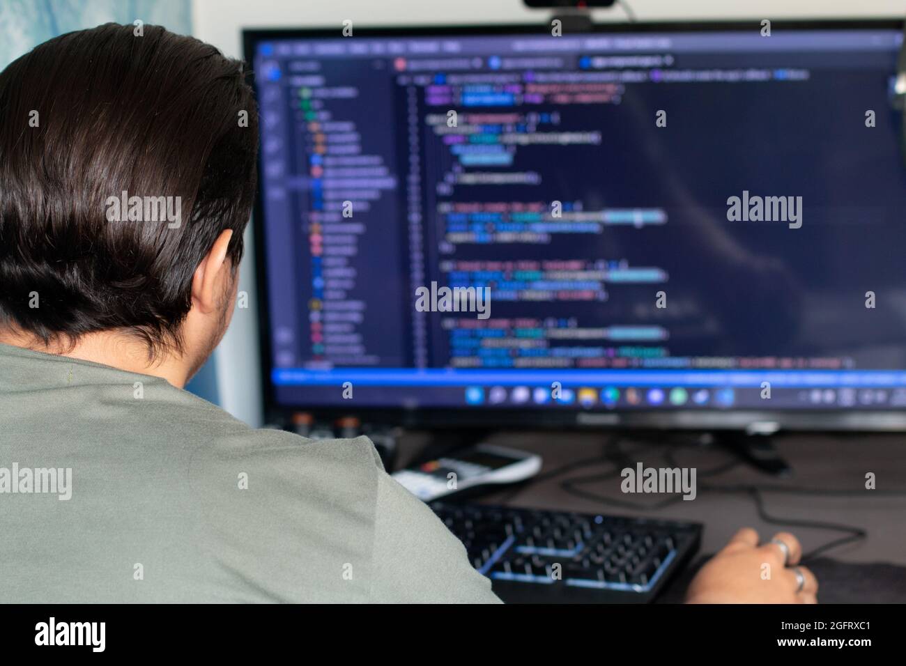 man creating hacking software Stock Photo