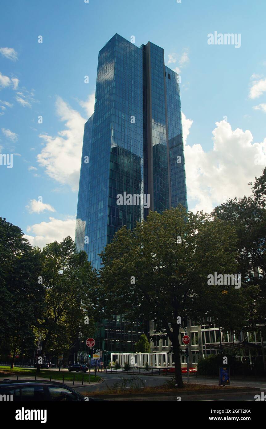 FRANKFURT, GERMANY - Aug 20, 2021: The Gallileo tower in Frankfurt in backlight. Blue cloudy sky with nice reflections on the glass facade. Built by D Stock Photo