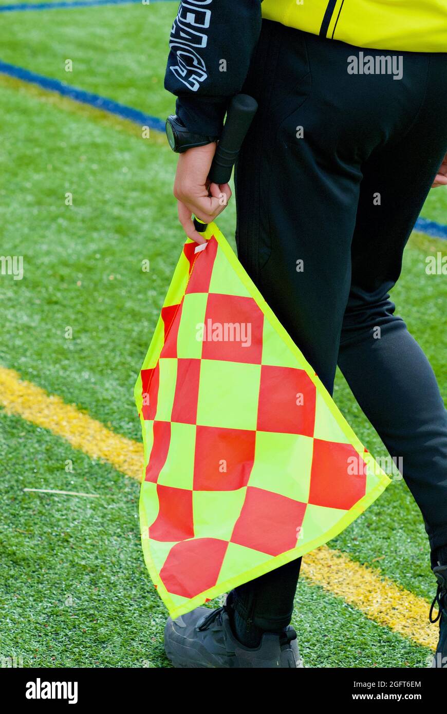 Annandale, Virginia / USA - April 24, 2021: Close-up image of a soccer sideline judge's colorful flag. Stock Photo