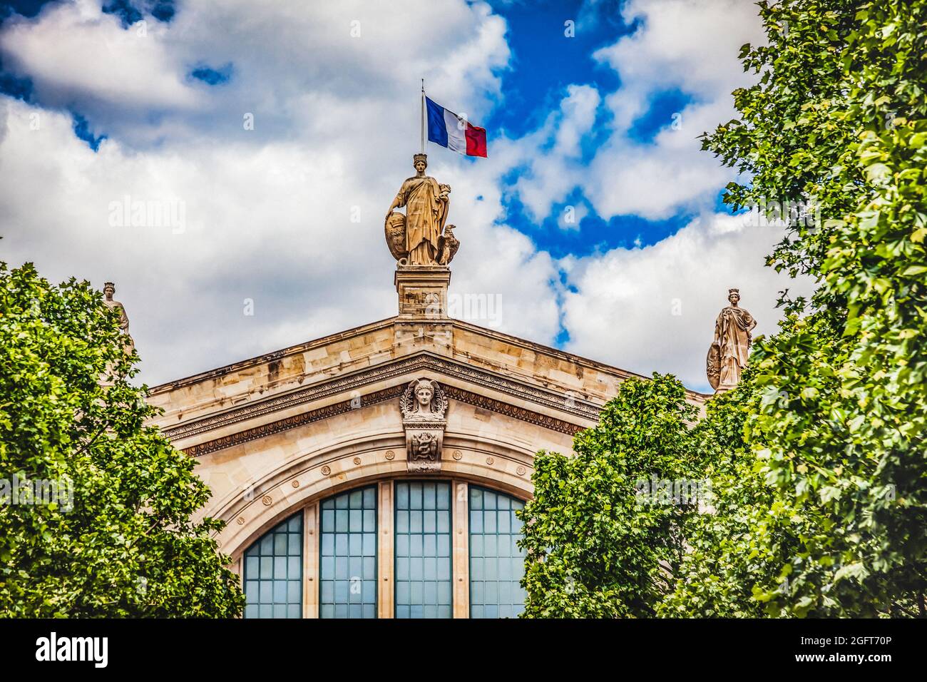 Gare du Nord North Train Station Flag Statue Building Paris France. Built in 1860s, one of six railroad stations in Paris Busiest railway station in E Stock Photo