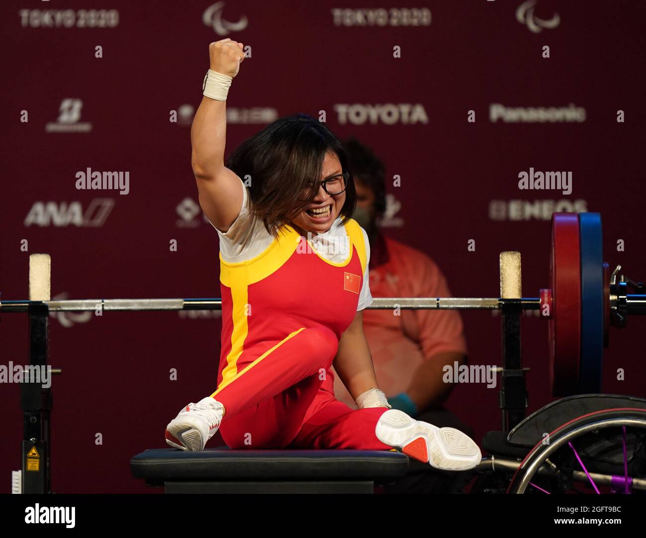 China's Dandan Hu celebrates after the third lift in the Women's -50 kg ...