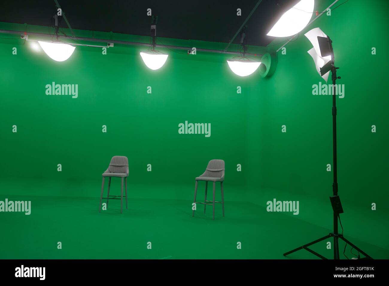 Green screen studio interview set-up with lighting Stock Photo - Alamy