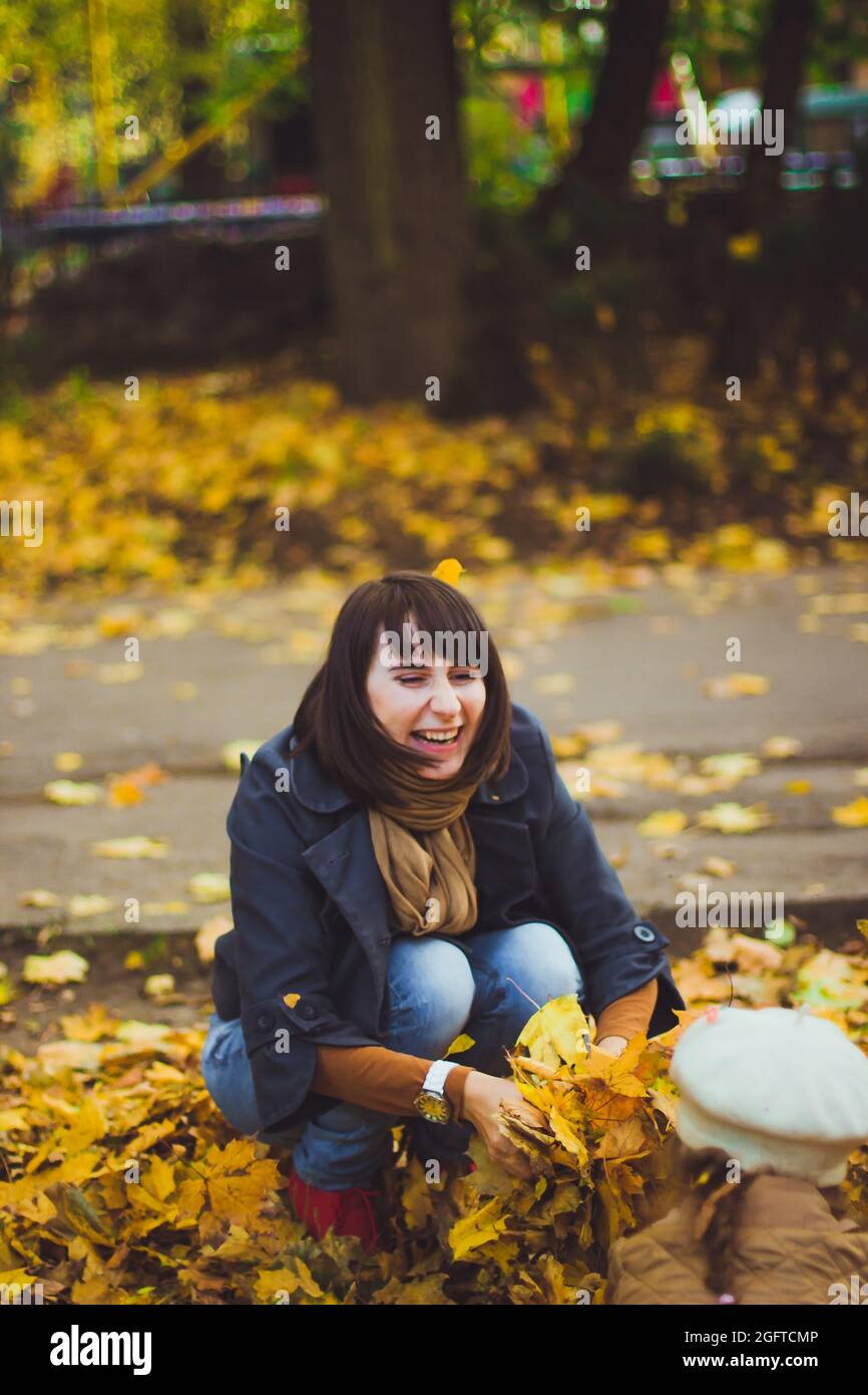 Young mother and her daughter have fun at autumn Stock Photo - Alamy