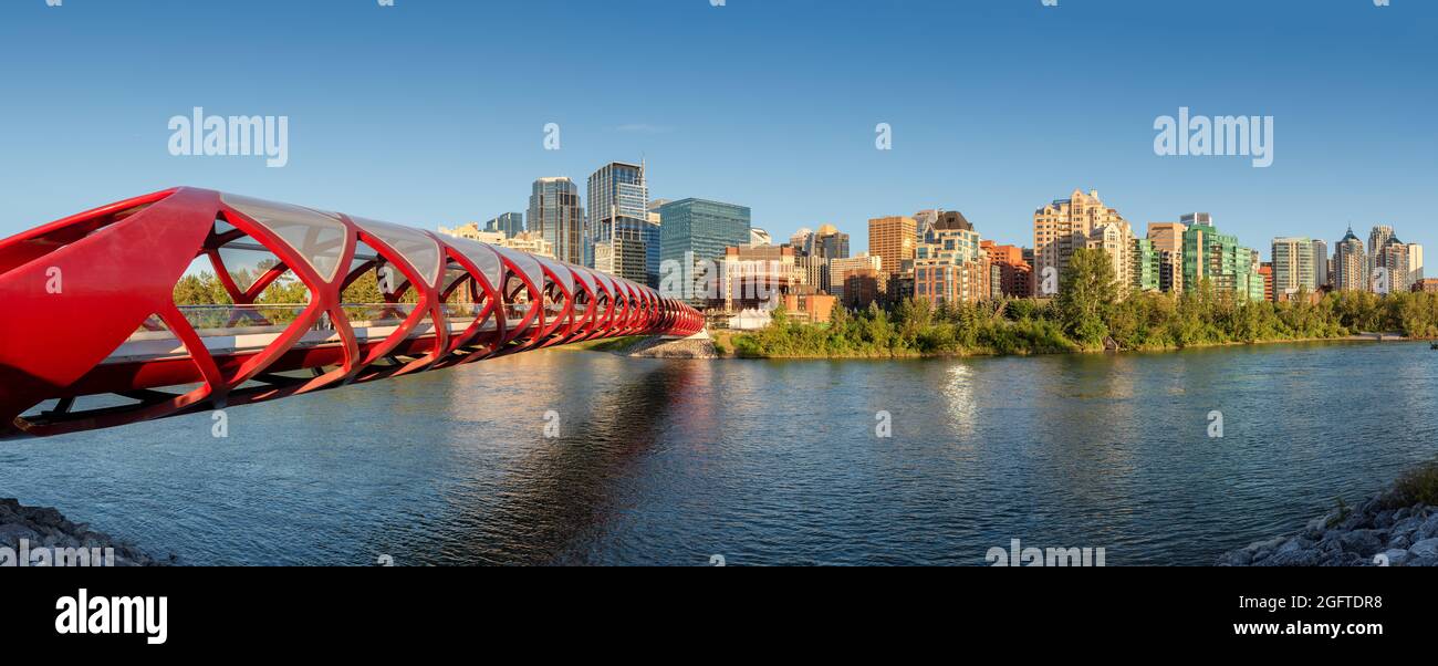 Calgary skyline at sunset with Peace Bridge and downtown in Calgary, Alberta, Canada. Stock Photo