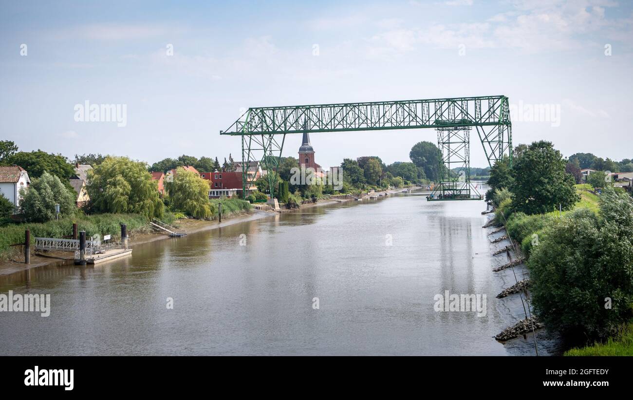 Osten, Germany. 12th Aug, 2021. The historic floating ferry crosses the Oste between Osten and Hemmoor. Credit: Sina Schuldt/dpa/Alamy Live News Stock Photo