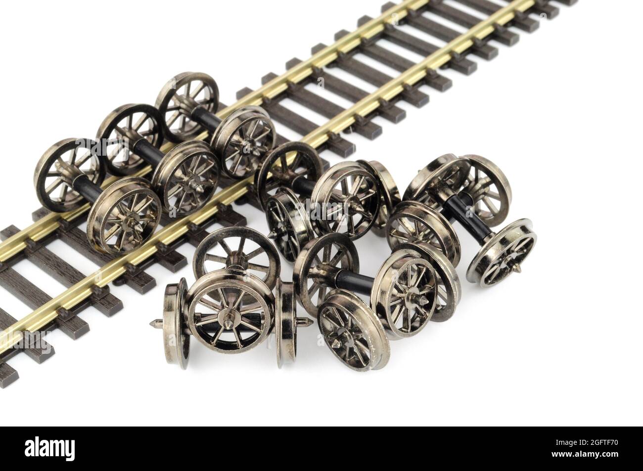 Group of metal spoked model railway wheels with axles in oo gauge or 1/