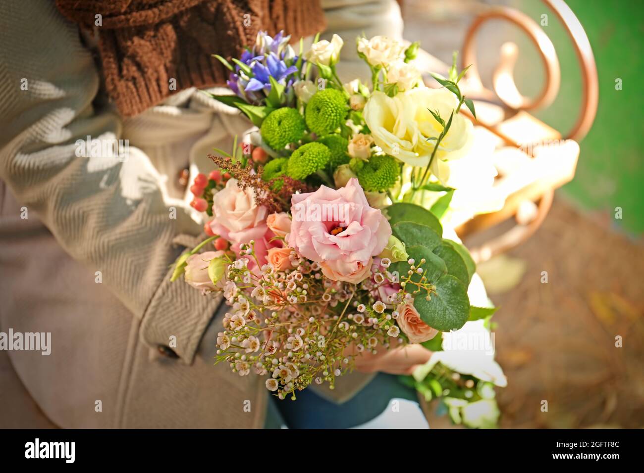 Closeup of female hands holding stylish bouquet of beautiful ...