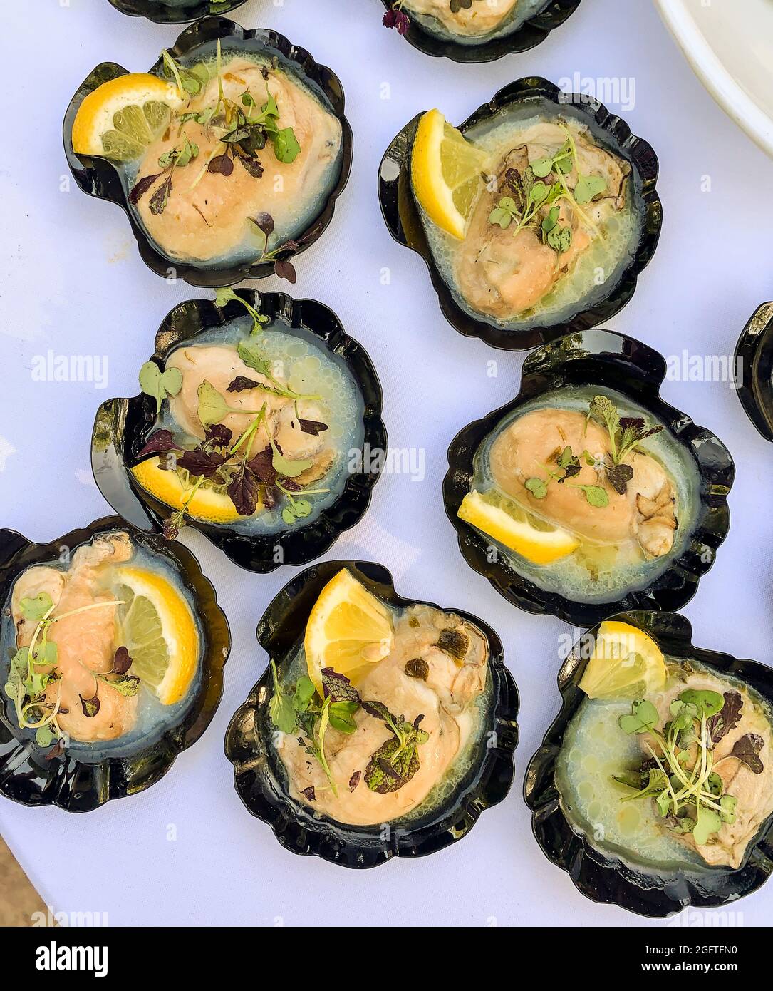 Smoked Oysters with Lemon Butter.  Hors d'oeuvres. Stock Photo