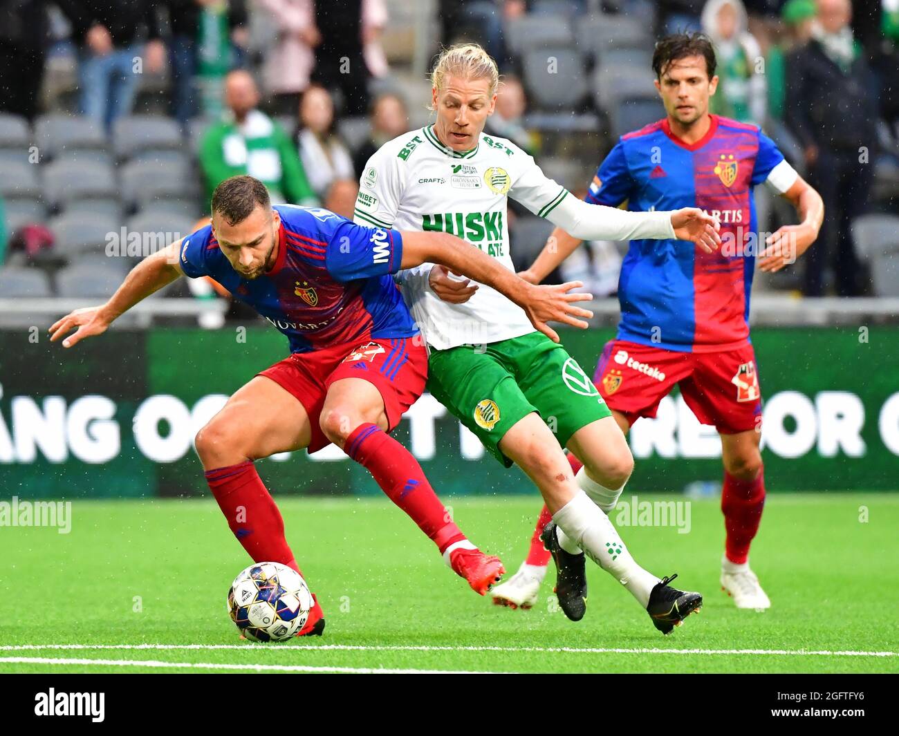 Basel´s PajtimKasami and Hammarby´s Gustav Ludwigson battles for the ball during the UEFA European Conference League second leg play-offs match between Hammarby IF and FC Basel at Tele2 Arena in Stockholm, Sweden, on Aug. 26, 2021. Photo: Jonas Ekstromer / TT kod 10030 Stock Photo