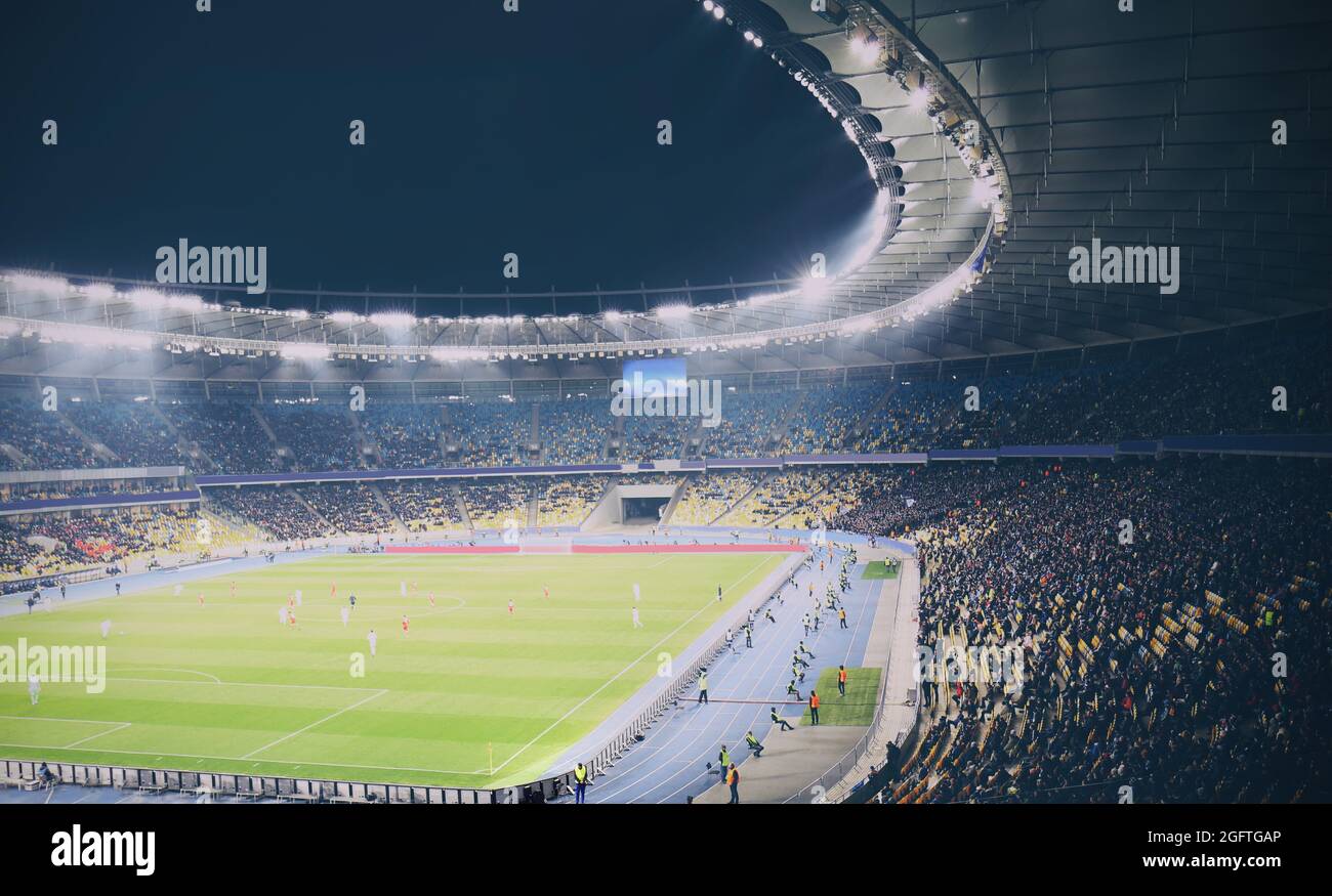 Panoramic view of modern stadium during football match Stock Photo