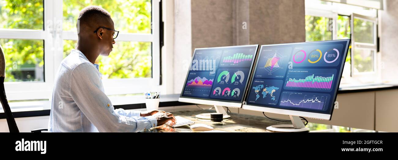 African Advisor Using KPI Dashboard With Financial Analytics Graphs Stock Photo