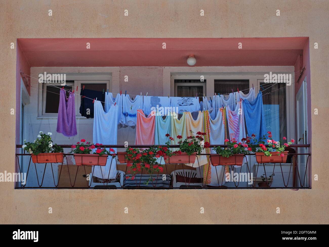 Laundry drying on the balcony of a building Stock Photo