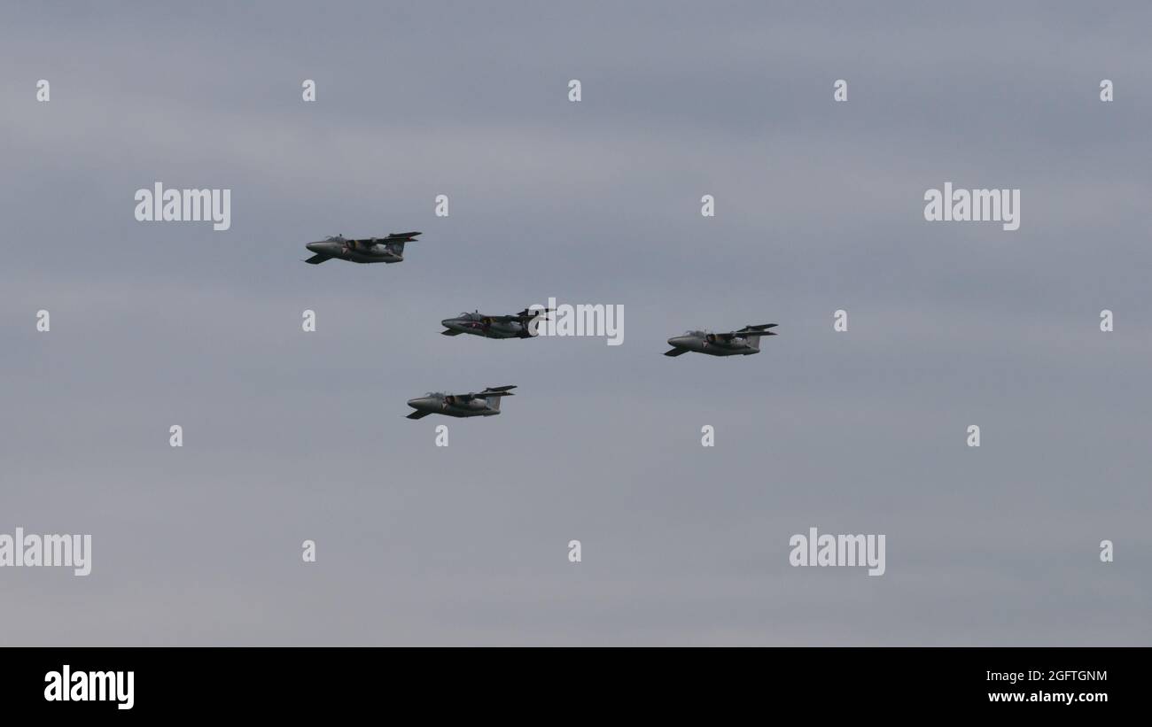 Zeltweg, Austria SEPTEMBER, 6, 2019 Four military airplanes in flight in formation in cloudy sky. Copy space. SAAB 105 of Austrian Air Force Stock Photo