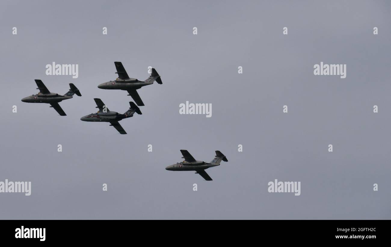 Zeltweg, Austria SEPTEMBER, 6, 2019 Four military airplanes in flight in formation in cloudy sky. Copy space. SAAB 105 of Austrian Air Force Stock Photo