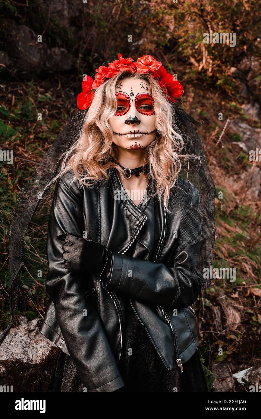 Closeup portrait of Calavera Catrina. Young woman with sugar skull makeup.  Dia de los muertos. Day of The Dead. Halloween Stock Photo - Alamy