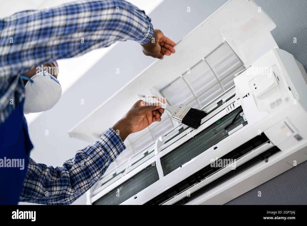 Air Conditioning Checking And Filter Cleaning. Maintenance Service Stock Photo