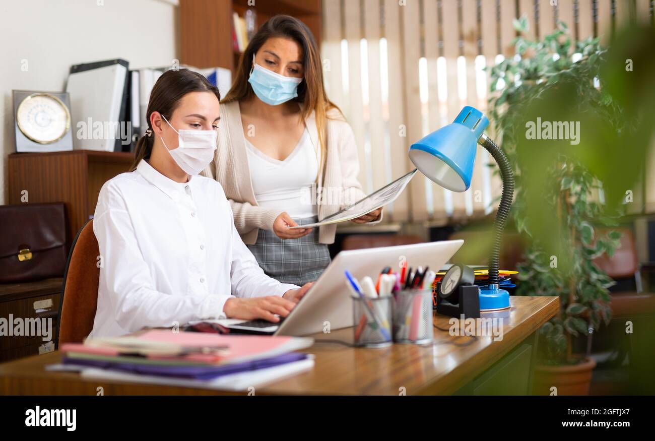 Business woman with assistant working at office Stock Photo - Alamy