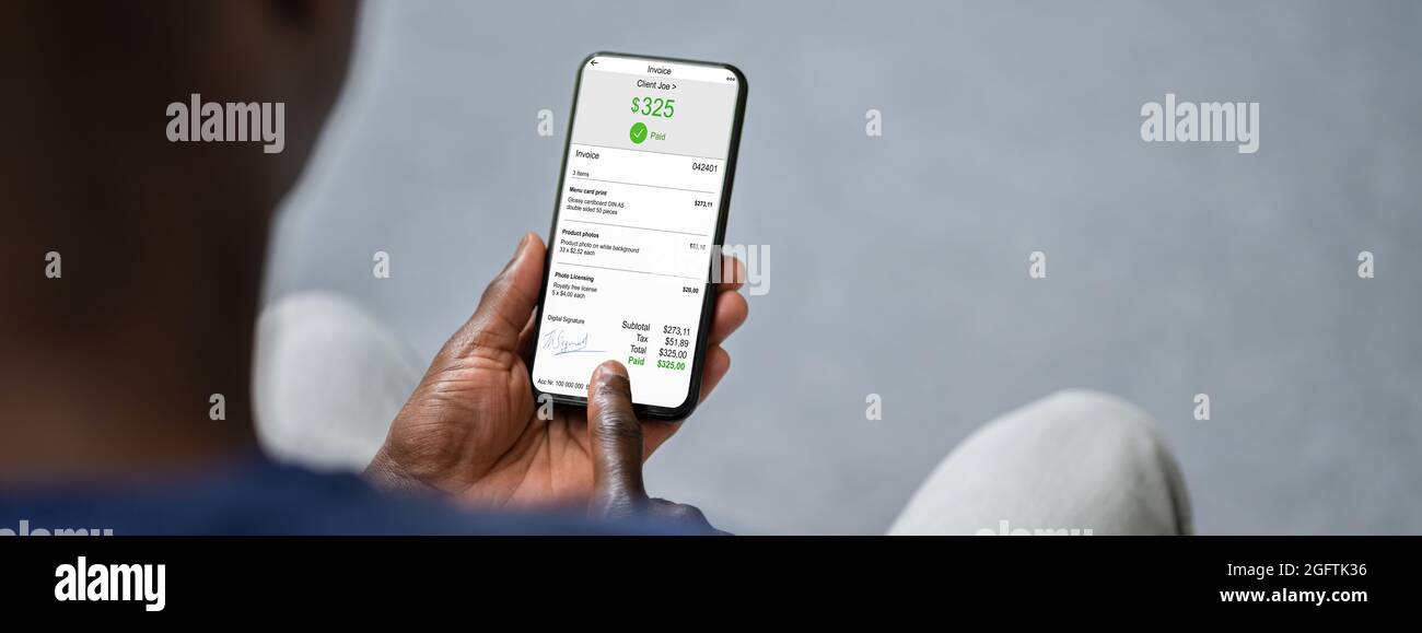 African Checking E Invoice Online On Phone Stock Photo