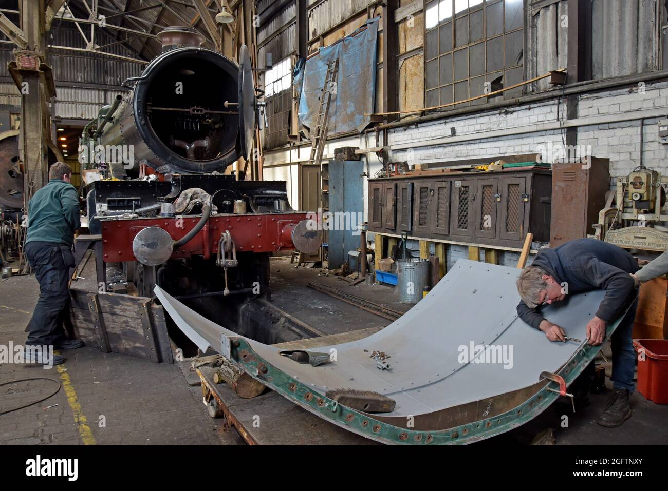 Volunteers at Didcot Railway Centre workshops working on the restoration of GWR steam loco 4079 Pendennis Castle Stock Photo