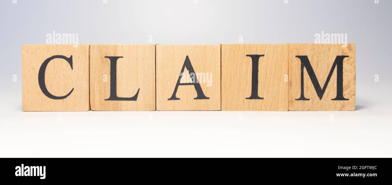 The word Claim was created from wooden cubes Stock Photo - Alamy