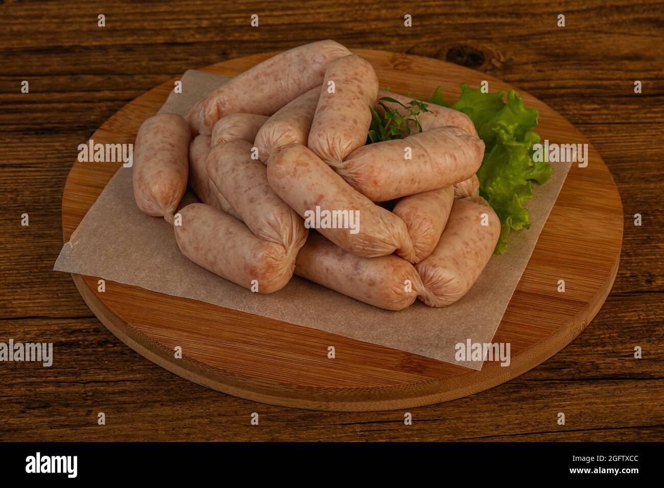 Raw natural chicken baby sausages for roast Stock Photo Alamy