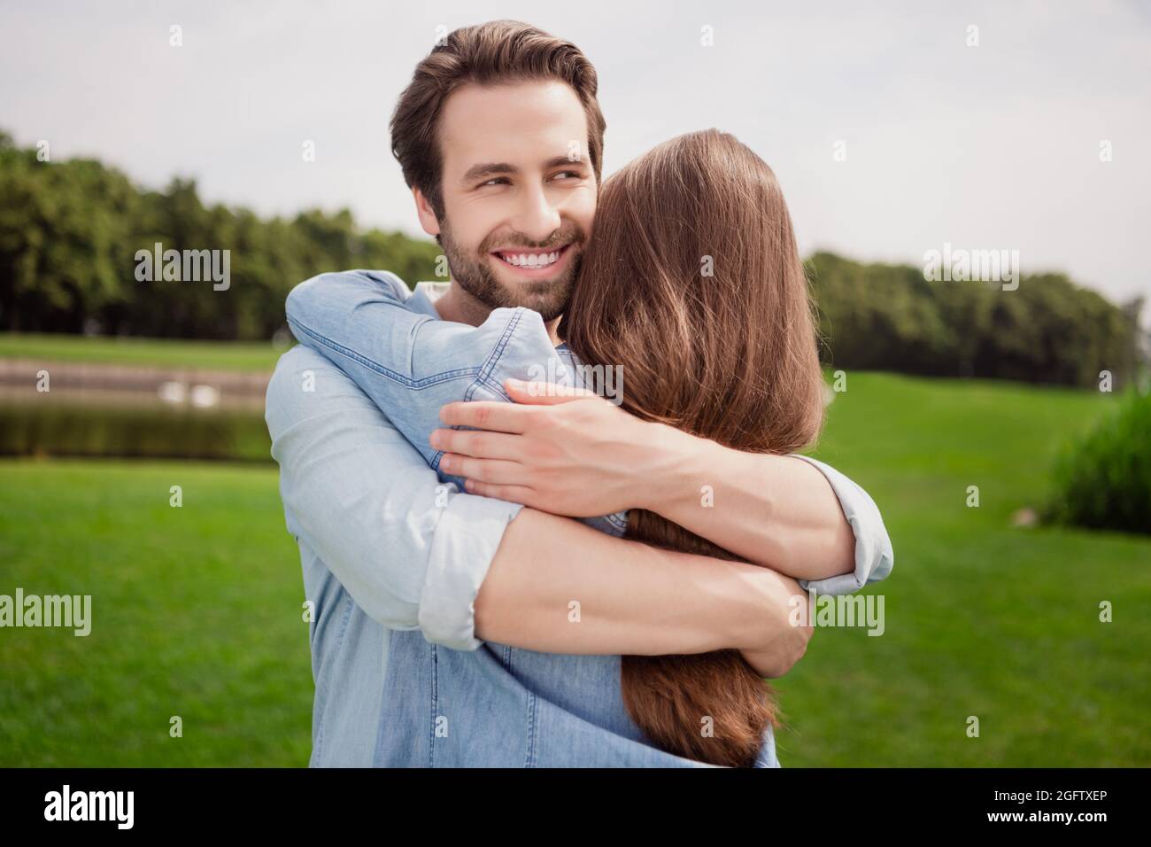 Photo of smiling handsome positive husband hug embrace wife best ...