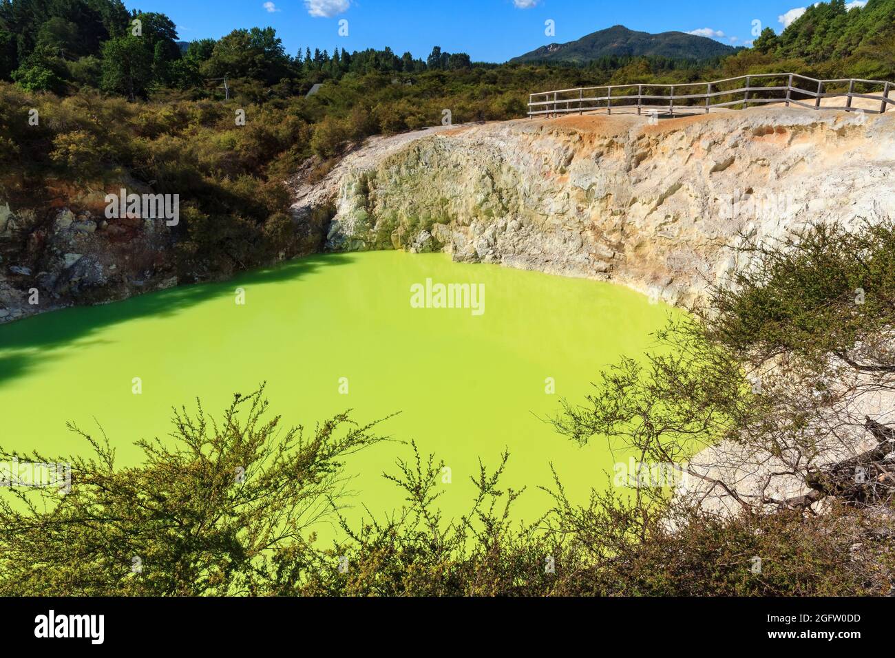 The 'Devil's Bath', a brightly colored pool in the Waiotapu geothermal area, New Zealand. The green color comes from sulfur deposits in the water Stock Photo
