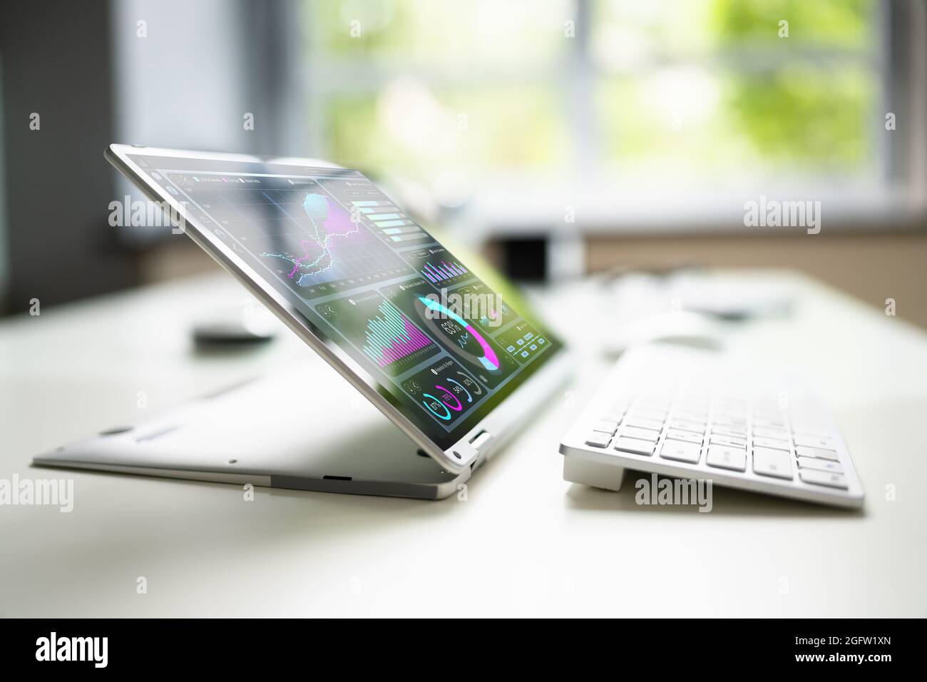 KPI Chart Dashboard On 2 In 1 Laptop Screen Stock Photo