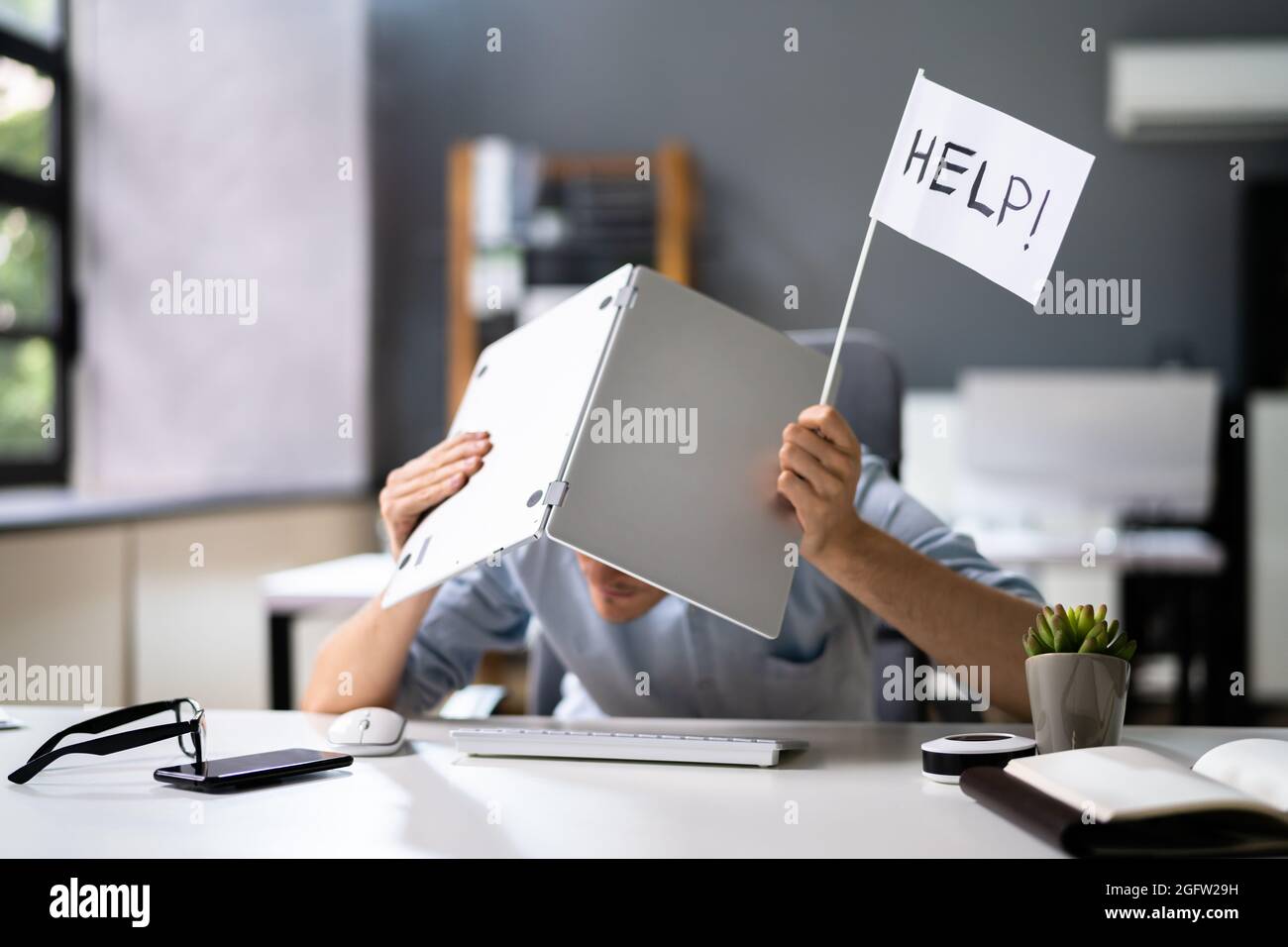 Tech Overload And Trouble. Overloaded Men With Laptop Computer Stock Photo