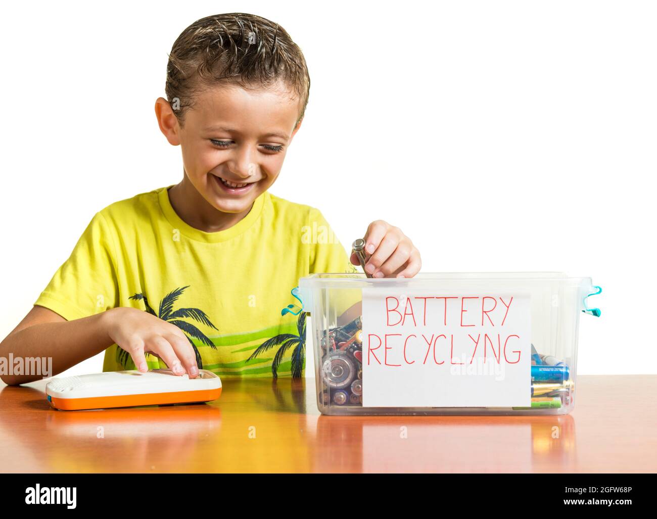 A child removing a dead battery from a toy and placing it in a