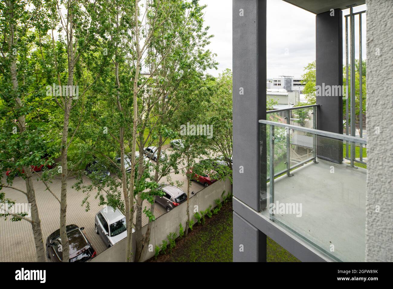 View of View of parking in courtyard from balcony of apartment in modern ...