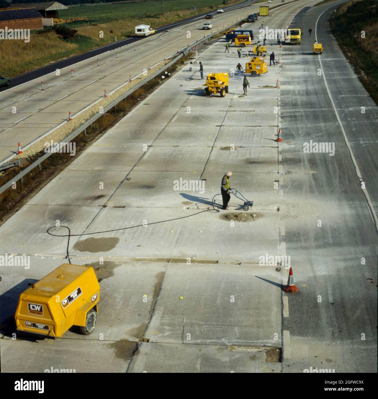 Repair work to the concrete surface of the M27 motorway westbound carriageway prior to junction 2, Hampshire, England, UK. Stock Photo