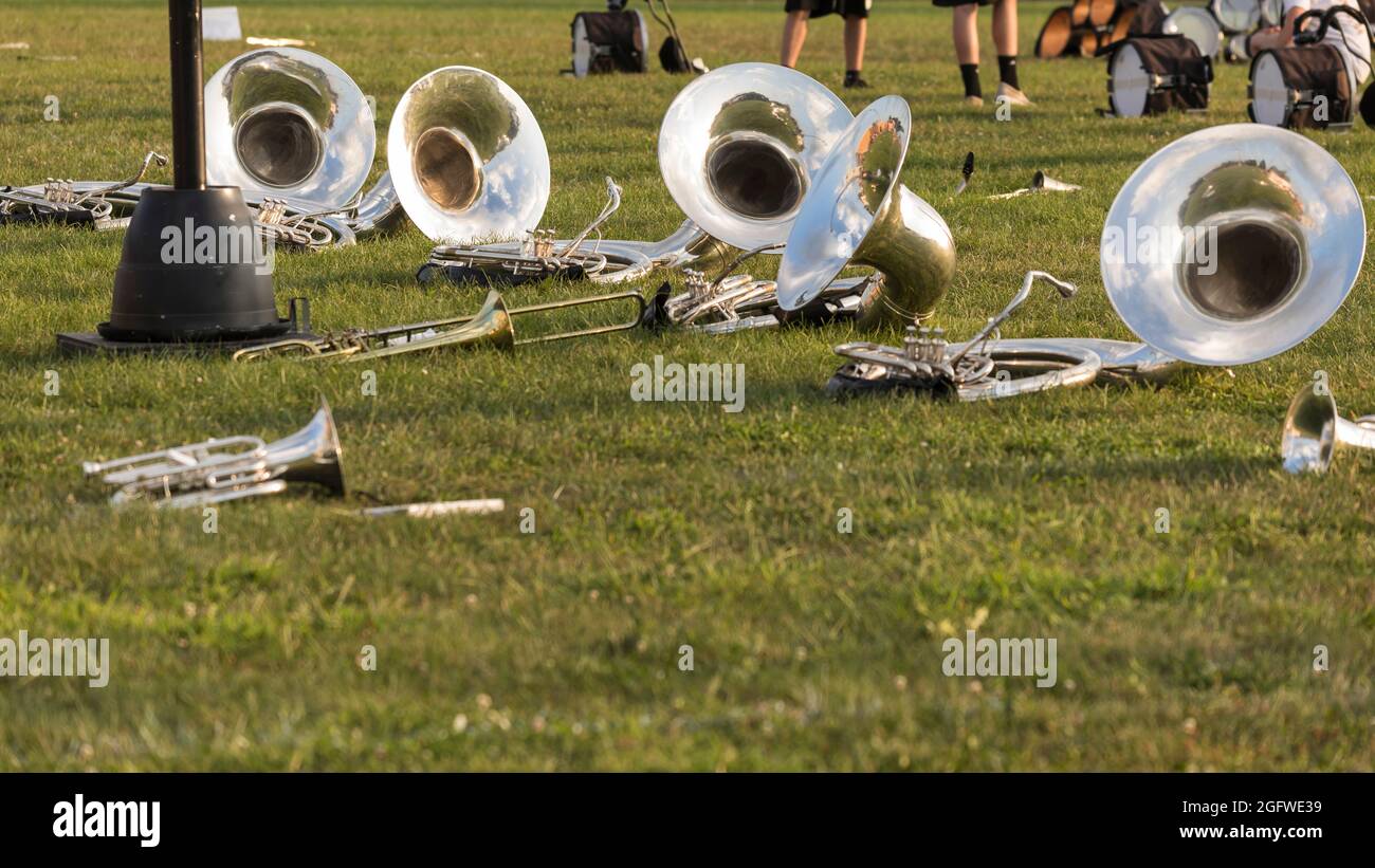 sousaphones and other brass instruments resting during a water break Stock Photo