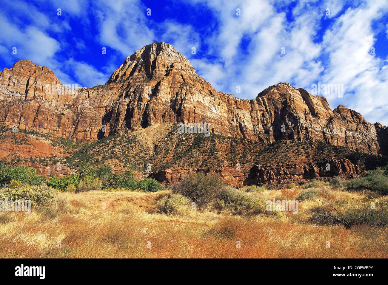 Rock peaks at the entrance to Zion Canyon, with red rock-faces and blue sky behind, USA, Utah, Zion National Park, Zion Canyon Stock Photo