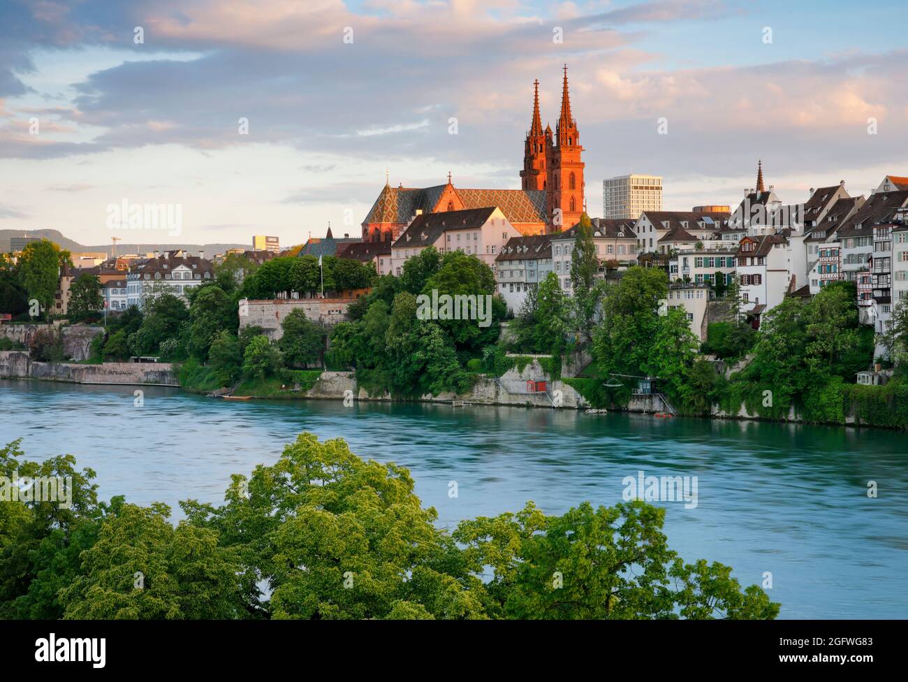 Basel Minster in the old town and the turquoise-coloured Rhine in the front, Switzerland, Bale Stock Photo