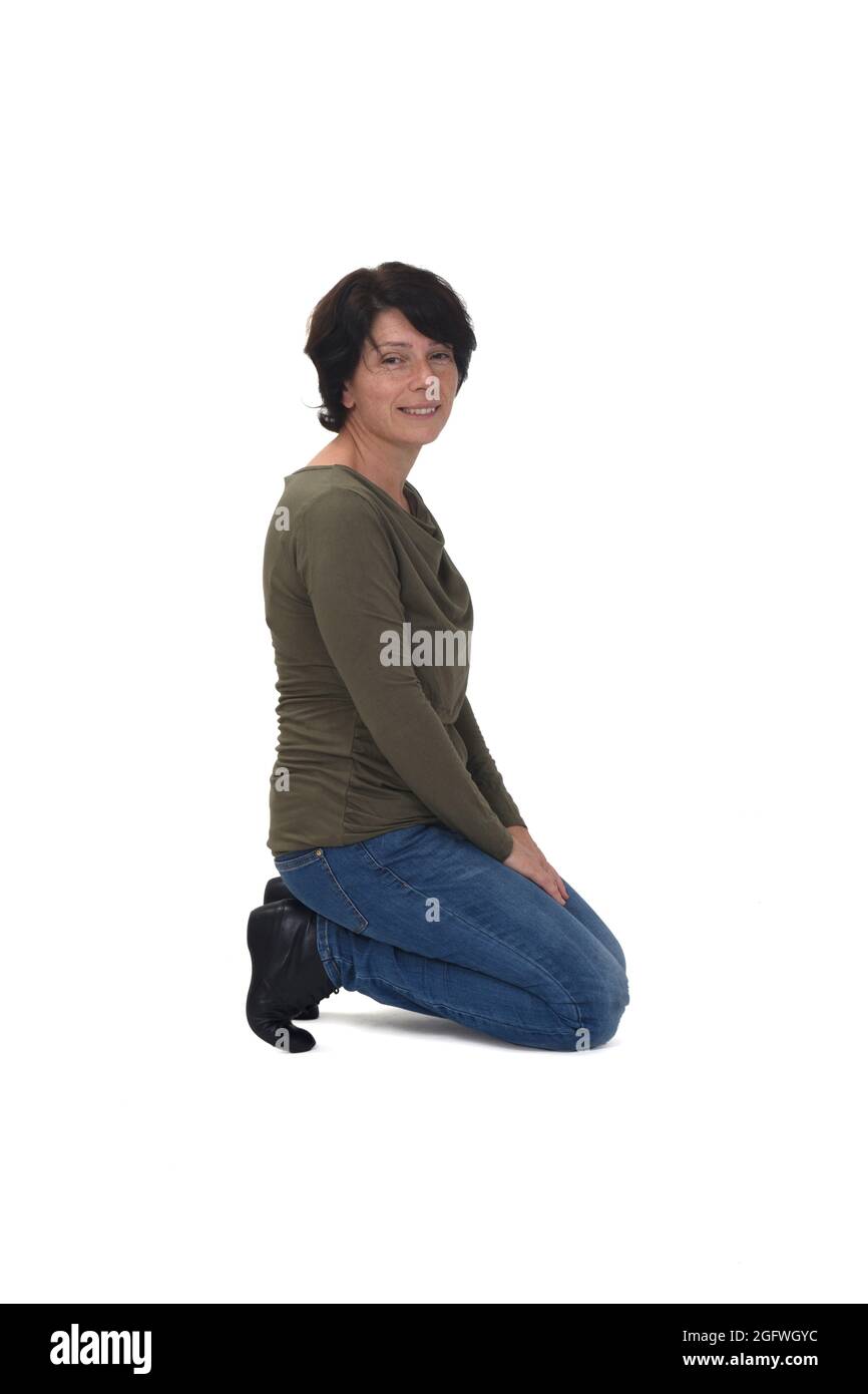 side view of a man kneeling on white background looking at camera Stock  Photo - Alamy